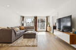Step into modern living with this stunning property, featuring a spacious living room perfect for entertaining.