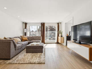 Step into modern living with this stunning property, featuring a spacious living room perfect for entertaining.