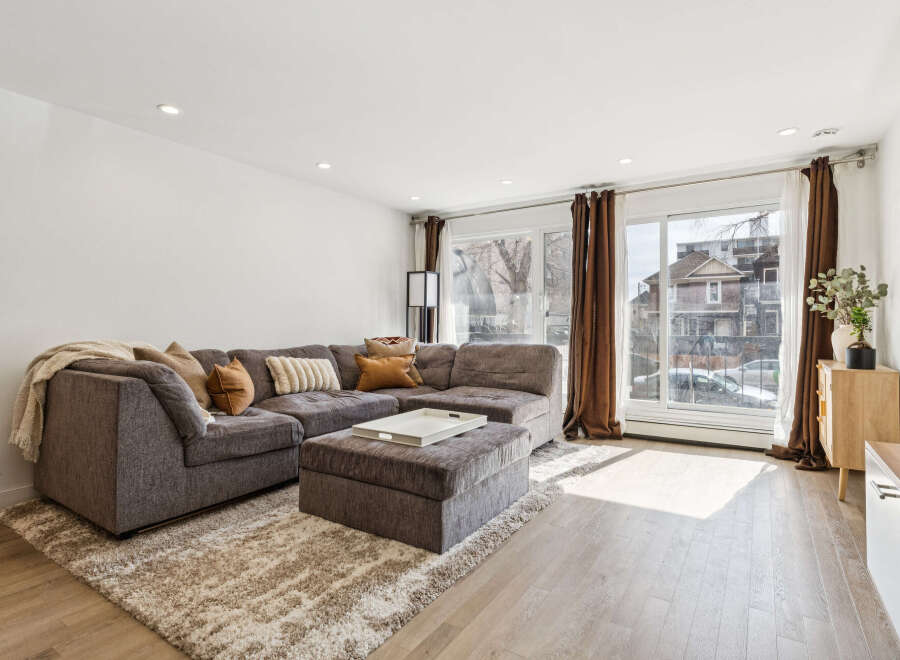 Step into this inviting living space, featuring a spacious sectional sofa perfect for relaxation and entertaining.