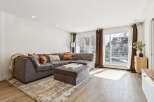 Step into this inviting living space, featuring a spacious sectional sofa perfect for relaxation and entertaining.