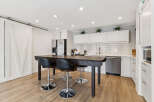 Step into this stunning kitchen, featuring a stylish island perfect for casual dining and entertaining.