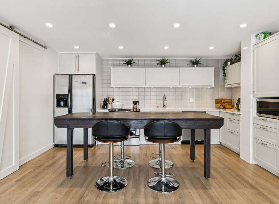 This modern kitchen boasts a sleek design with a large island perfect for entertaining.