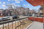 Enjoy stunning views from this charming property, featuring a private balcony overlooking a tree-lined street.