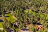 Discover a stunning property nestled amidst a lush forest and a meticulously maintained golf course.