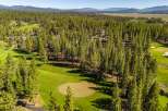Discover the tranquility of this stunning golf course property, nestled amidst a lush forest.