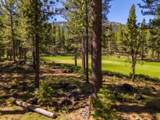 Discover the tranquility of this stunning property, nestled amidst a lush, green golf course.