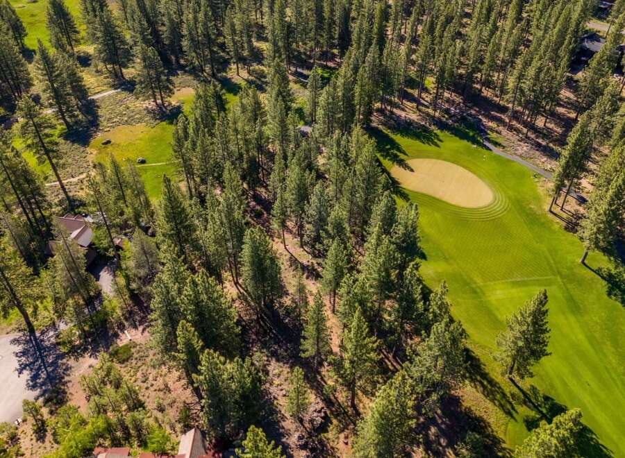 Discover a stunning property nestled amidst lush greenery and a meticulously maintained golf course.