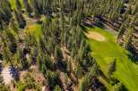 Discover a stunning property nestled amidst lush greenery and a meticulously maintained golf course.