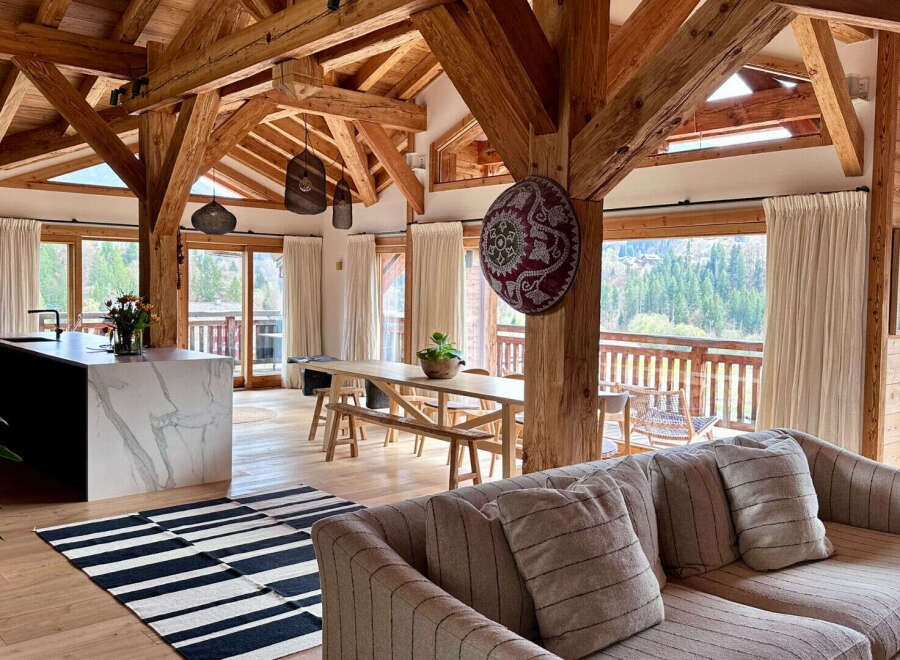 Experience luxury living in this stunning property featuring exposed wooden beams, creating a warm and inviting atmosphere.