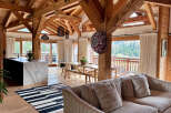 Experience luxury living in this stunning property featuring exposed wooden beams, creating a warm and inviting atmosphere.