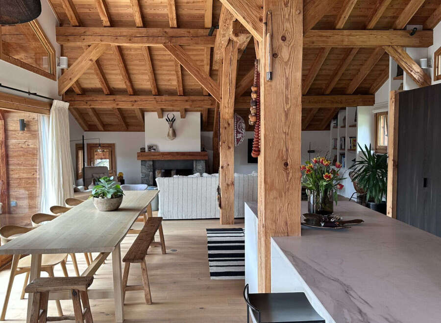 Experience rustic elegance in this stunning property, featuring exposed wooden beams and a cozy fireplace.