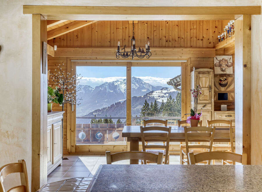 Experience the charm of this stunning property, featuring a warm and inviting wooden interior.