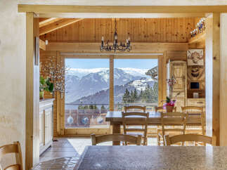 Experience the charm of this stunning property, featuring a warm and inviting wooden interior.
