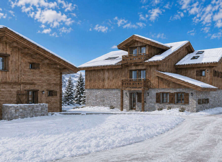 Experience the ultimate winter retreat in this stunning log cabin, nestled amidst snow-covered mountains and evergreen trees.