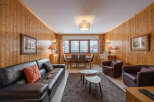 Step into this cozy chalet, featuring warm wood paneling and a welcoming atmosphere.