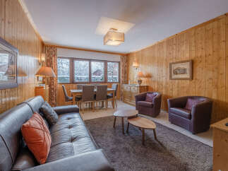 Step into a cozy and inviting living space, perfect for relaxing after a day on the slopes.