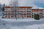 Discover a charming property nestled in a snowy landscape, perfect for a winter getaway.