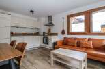 Discover this charming property featuring a modern kitchen and a cozy living area.