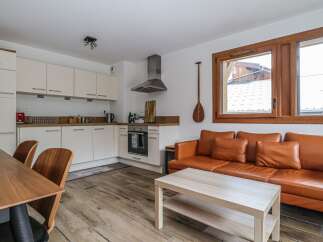 Discover this charming property featuring a modern kitchen and a cozy living area.