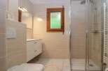 Step into this beautifully designed bathroom, featuring a modern shower and elegant vanity.