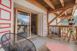 Enjoy breathtaking mountain views from this charming balcony.