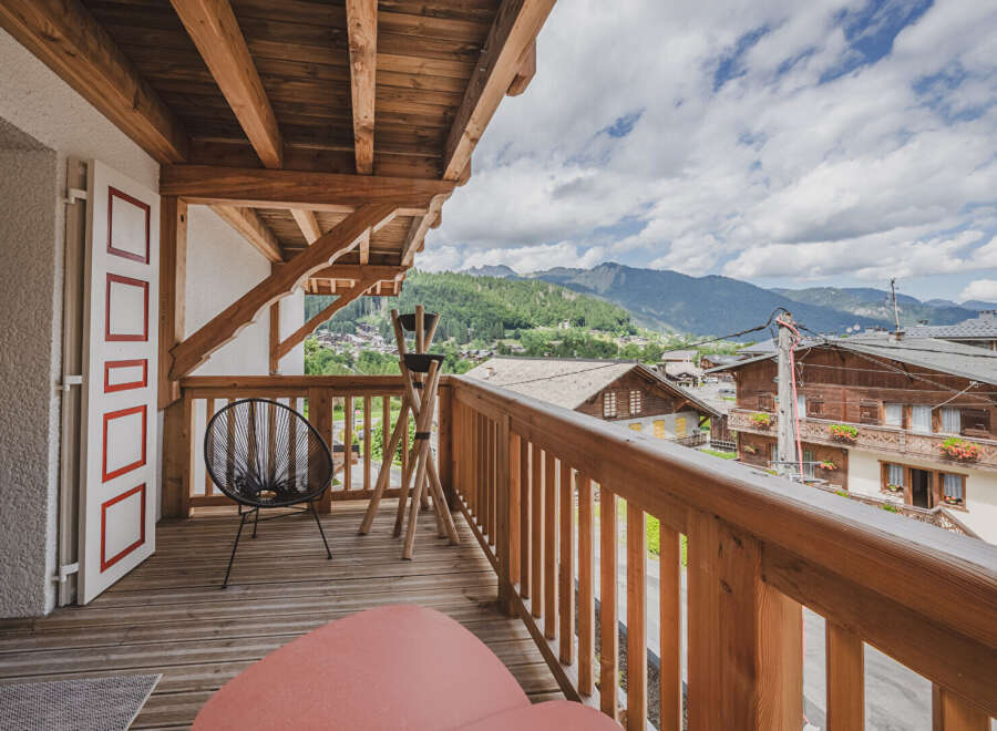 Enjoy breathtaking mountain views from this charming balcony.