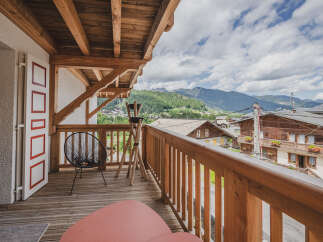 Enjoy breathtaking mountain views from this charming balcony.