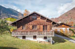 Discover the charm of this stunning wooden chalet nestled in a picturesque mountain setting.