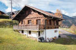 Nestled in a picturesque landscape, this charming wooden chalet offers a tranquil retreat.