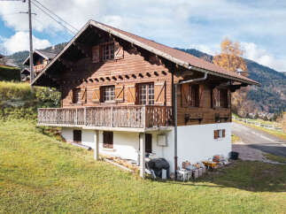 Nestled in a picturesque landscape, this charming wooden chalet offers a tranquil retreat.
