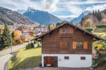 Nestled in a picturesque mountain setting, this charming wooden chalet offers a tranquil retreat.