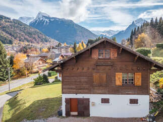 Nestled in a picturesque mountain setting, this charming wooden chalet offers a tranquil retreat.
