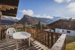 Enjoy breathtaking mountain views from this charming balcony.