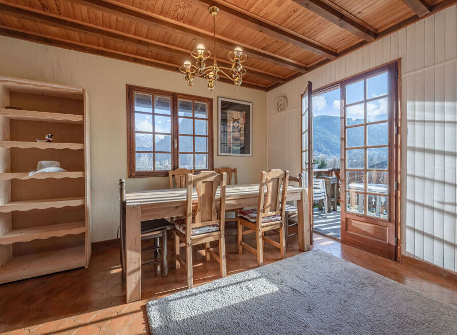 This charming dining room offers a warm and inviting atmosphere, perfect for enjoying meals with family and friends.