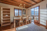This charming dining room offers a warm and inviting atmosphere, perfect for enjoying meals with family and friends.
