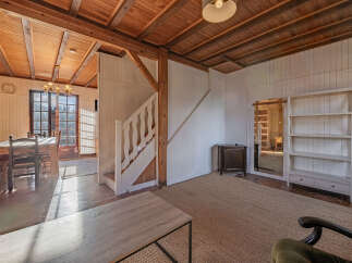 Step into this charming property with a warm and inviting interior.