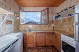 This charming kitchen offers a cozy and inviting atmosphere.