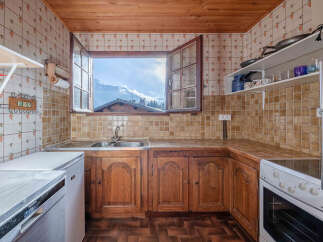 This charming kitchen offers a cozy and inviting atmosphere.