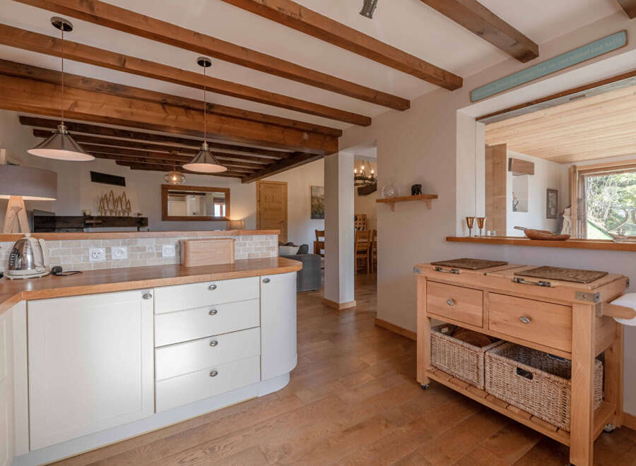 This charming kitchen boasts a warm and inviting atmosphere, perfect for culinary creations and family gatherings.