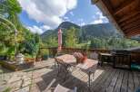 Enjoy breathtaking mountain views from this charming outdoor deck.