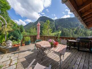 Enjoy breathtaking mountain views from this charming outdoor deck.