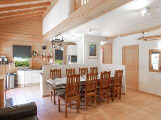 This charming property boasts a spacious open-plan layout, perfect for entertaining and family gatherings.