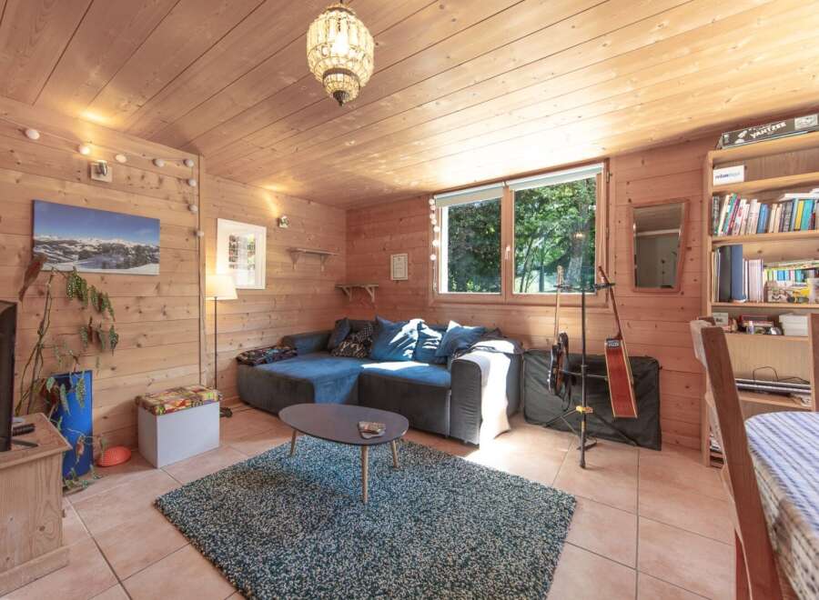 This cozy living space features a comfortable sectional sofa, perfect for relaxing.