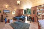 This cozy living space features a comfortable sectional sofa, perfect for relaxing.
