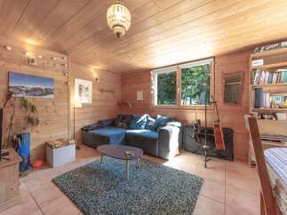 This cozy living space features a comfortable sectional sofa, perfect for relaxing.