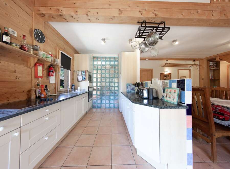 This charming kitchen boasts a rustic design with wooden accents and ample counter space.
