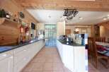 This charming kitchen boasts a rustic design with wooden accents and ample counter space.
