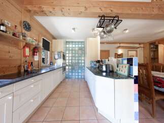 This charming kitchen boasts a rustic design with wooden accents and ample counter space.