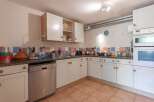 Discover the charm of this well-equipped kitchen, perfect for culinary enthusiasts.