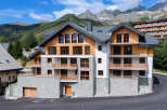 Experience luxury mountain living in this stunning alpine property, featuring a modern design with natural wood and stone accents.